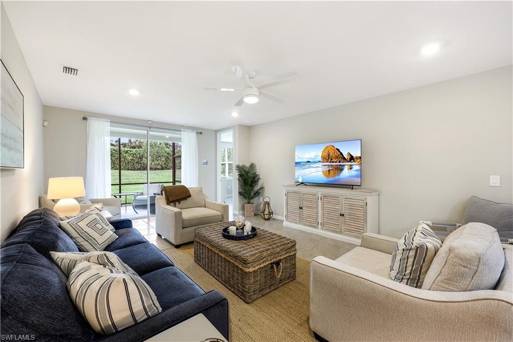 Living area with recessed lighting and a ceiling fan
