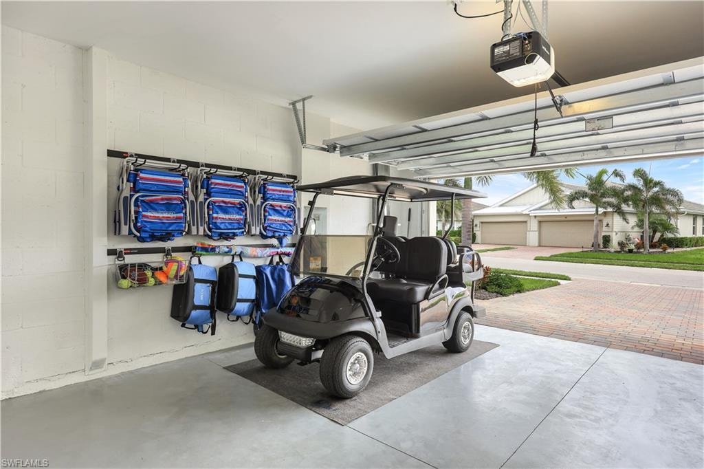 Garage with a garage door opener and concrete block wall