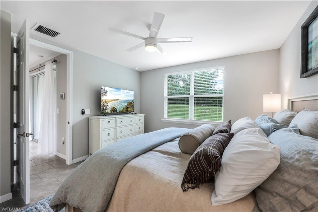 Bedroom with baseboards and ceiling fan