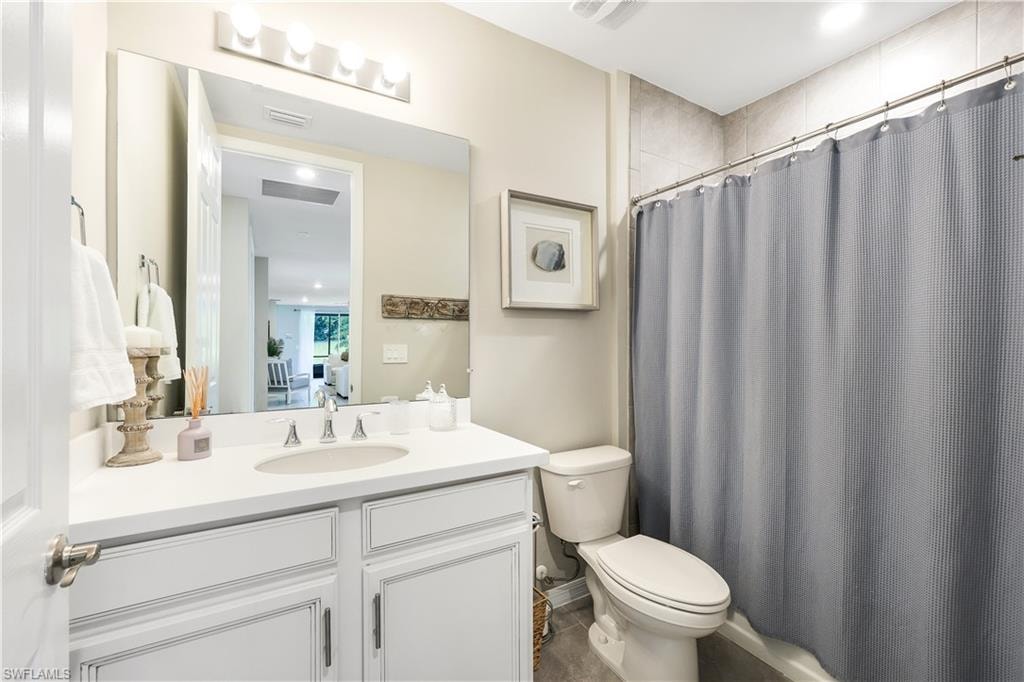 Ensuite bathroom with vanity and toilet