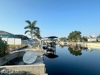 Dock featuring a water view and boat lift