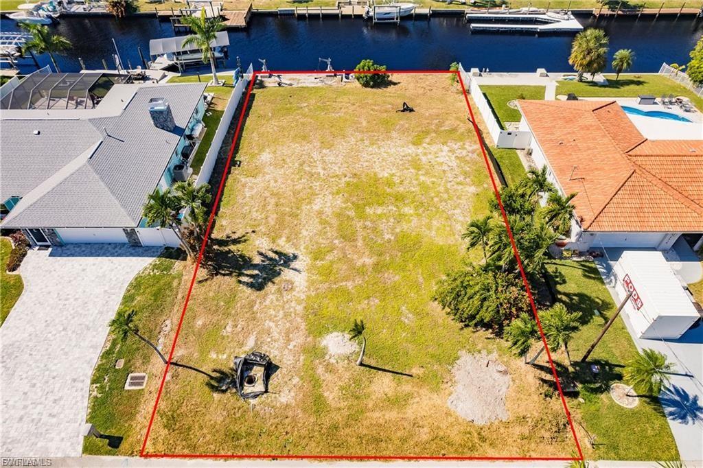 Aerial overview of property's location featuring property boundaries highlighted and a large body of water