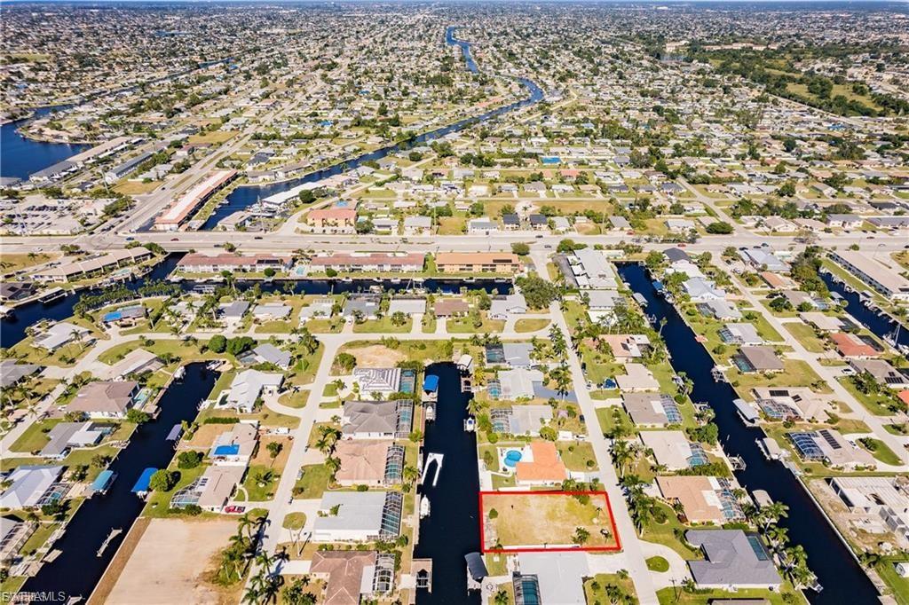 Aerial view of residential area featuring a large body of water