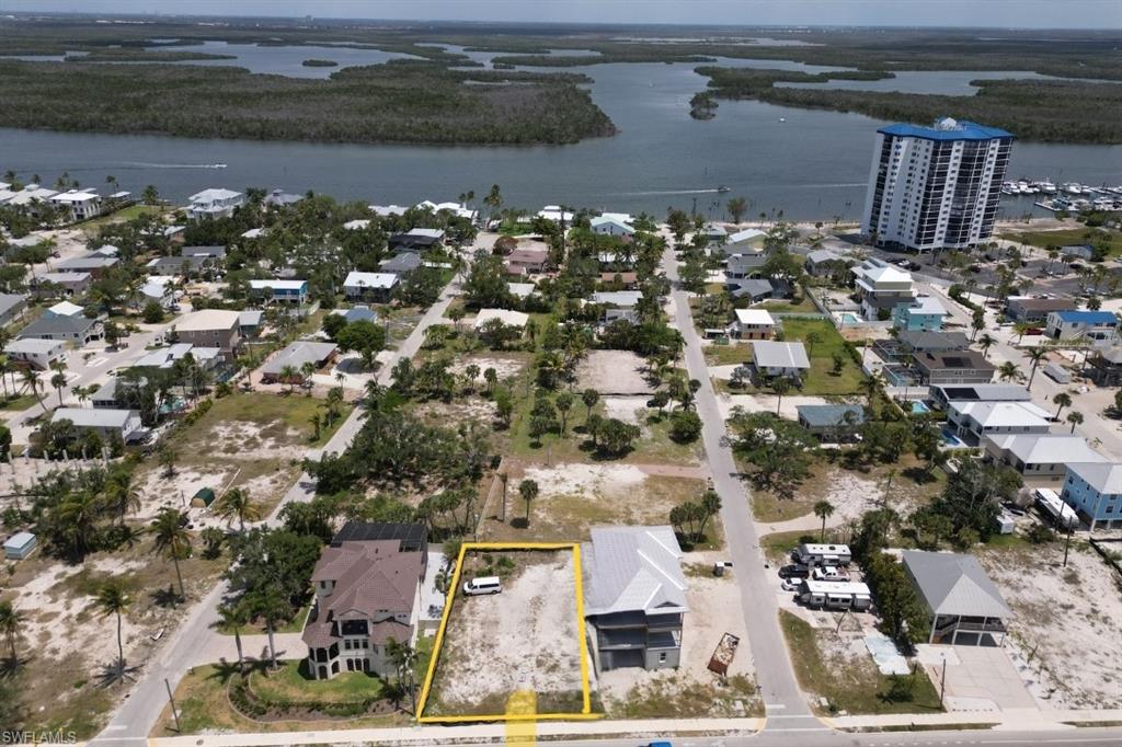Aerial perspective looking East to intercoastal body of water and property parcel outlined