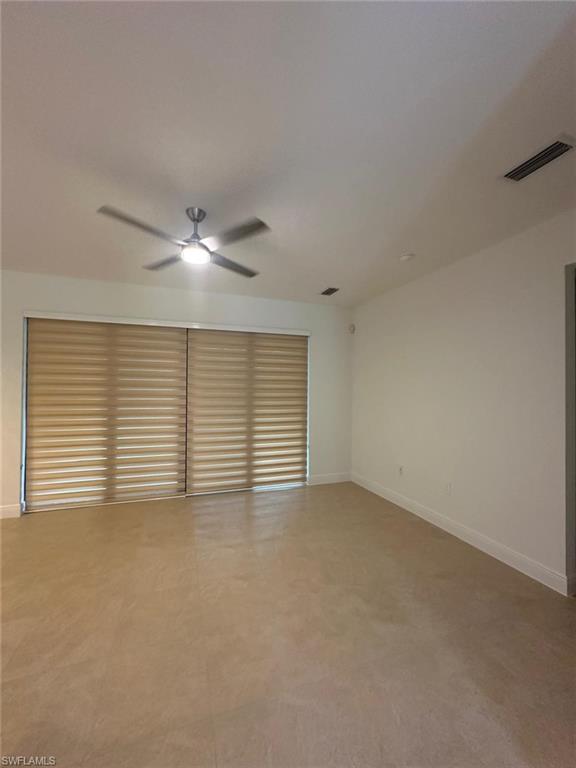 Empty room featuring baseboards