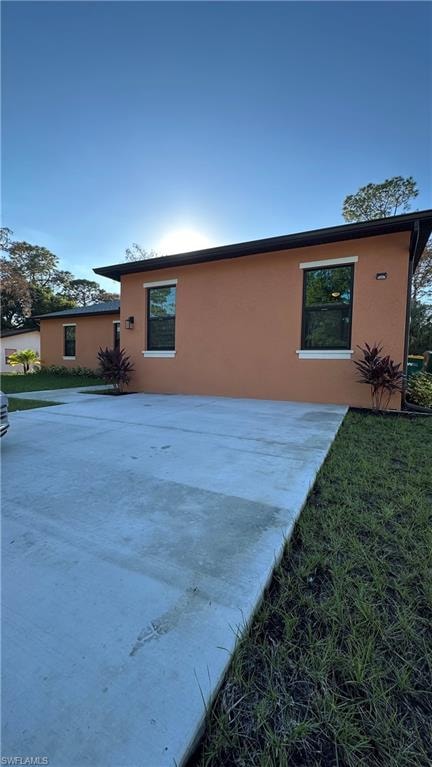View of side of property with stucco siding