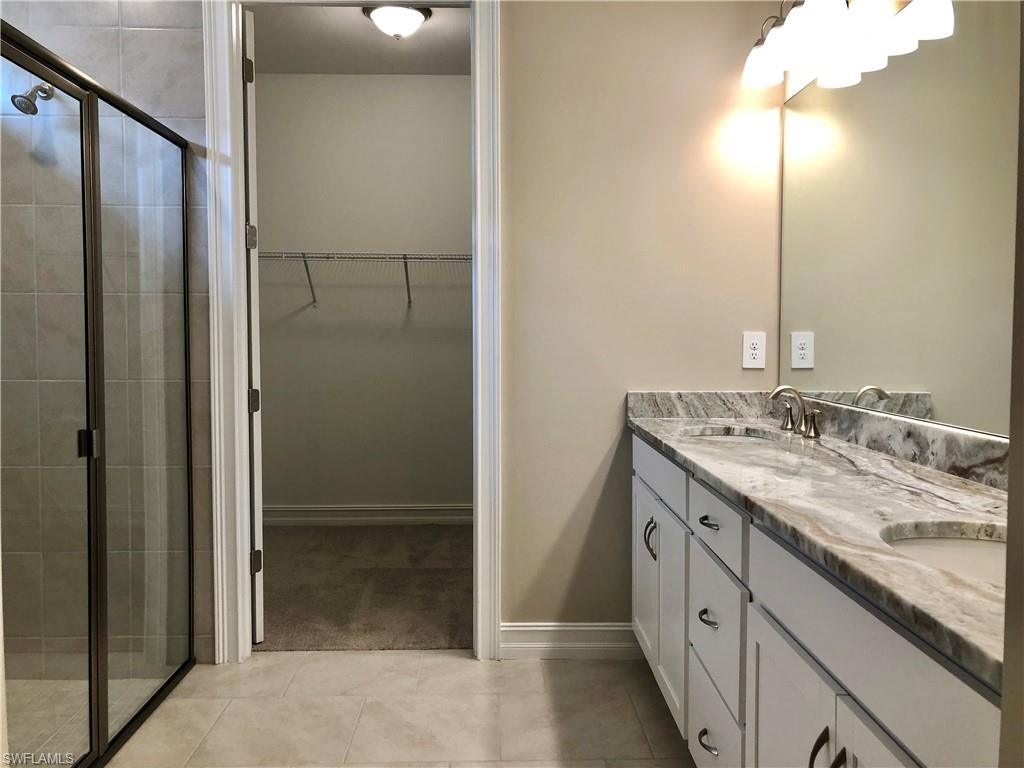 Kitchen featuring decorative light fixtures, a chandelier, ceiling fan, and recessed lighting