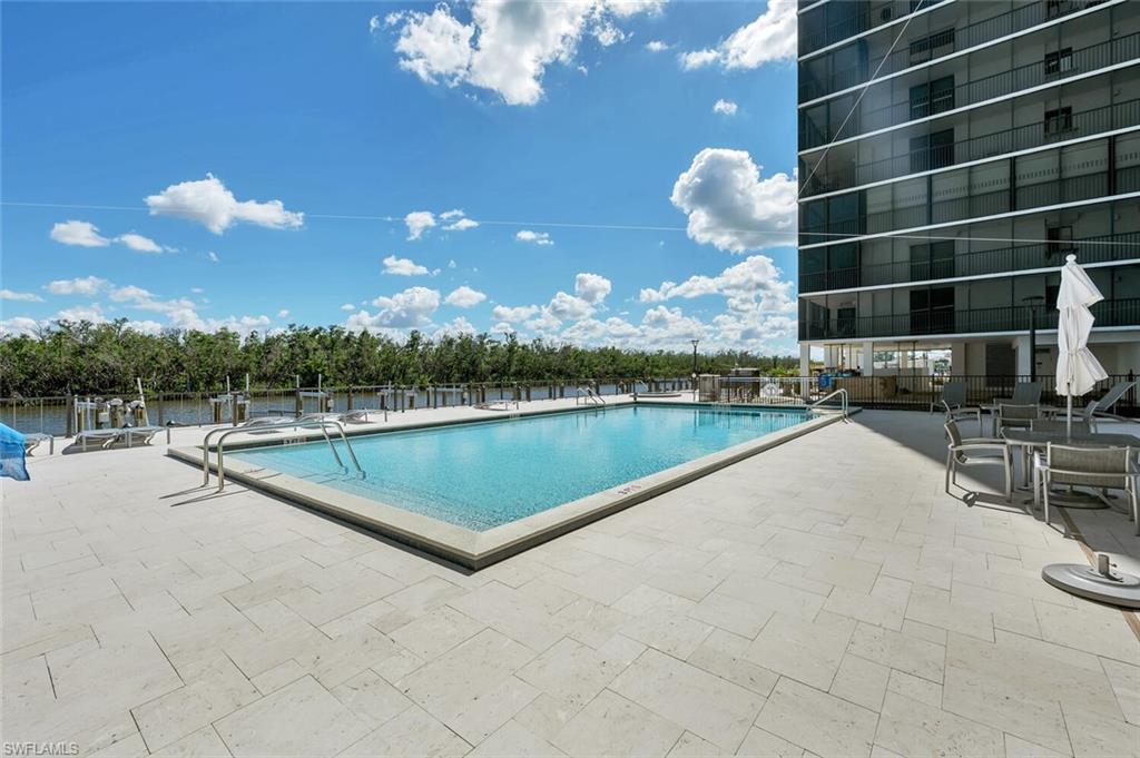 Community pool with a patio