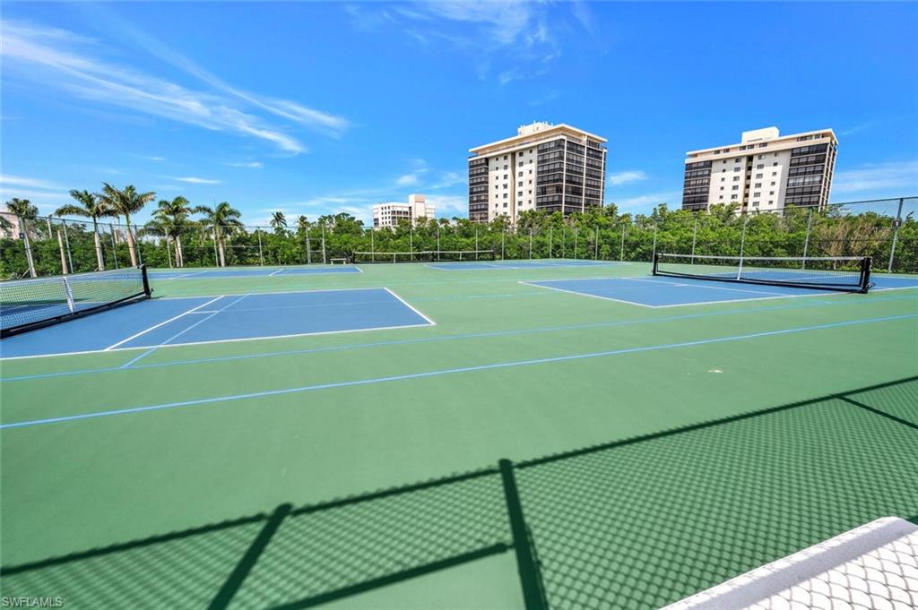 View of tennis court with community basketball court