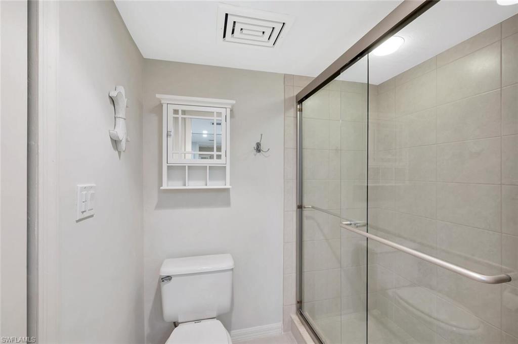 Full bathroom with a stall shower