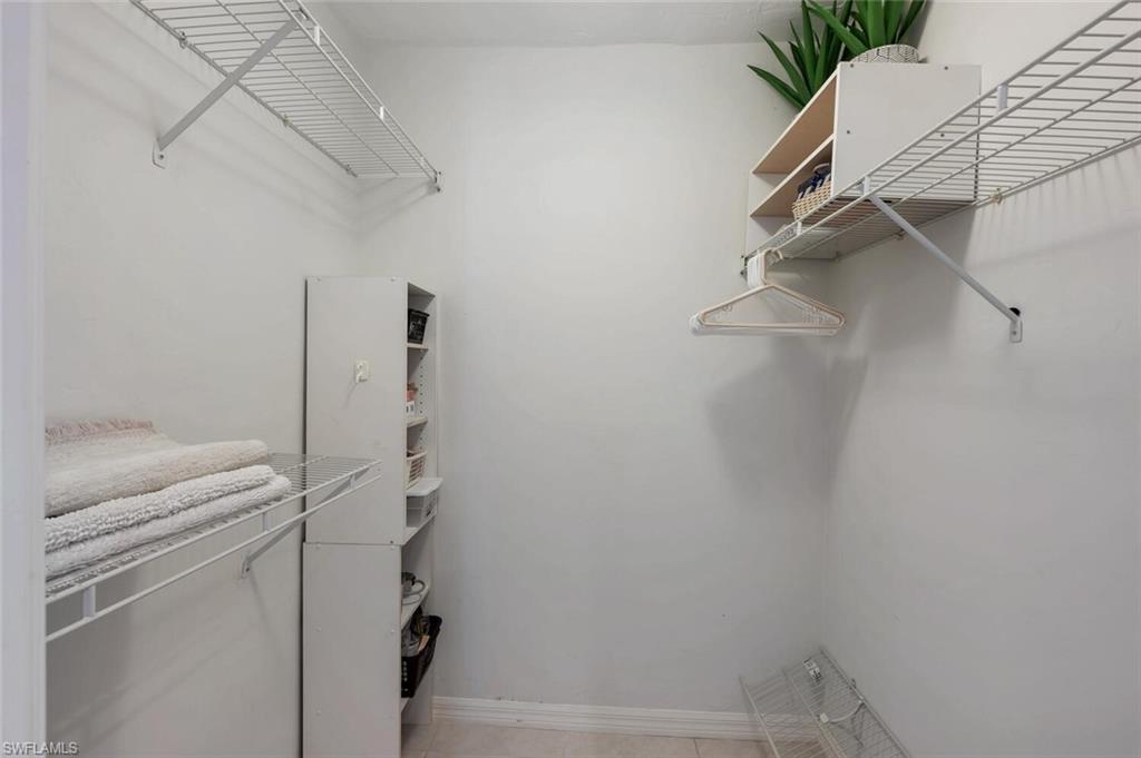 Walk in closet featuring light tile patterned floors