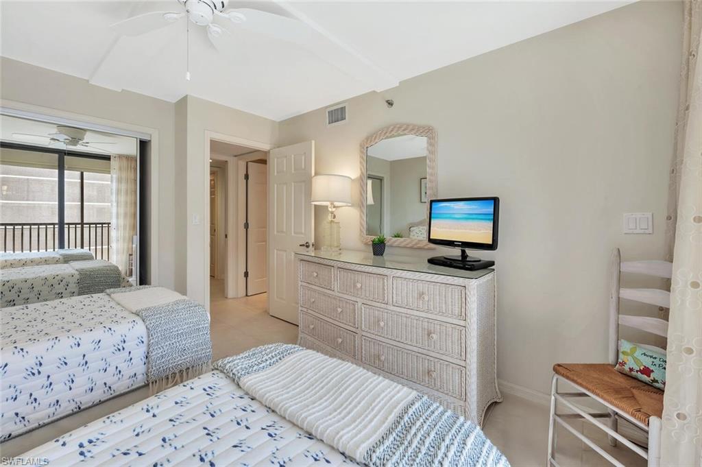Bedroom featuring access to exterior, ceiling fan, and light colored carpet