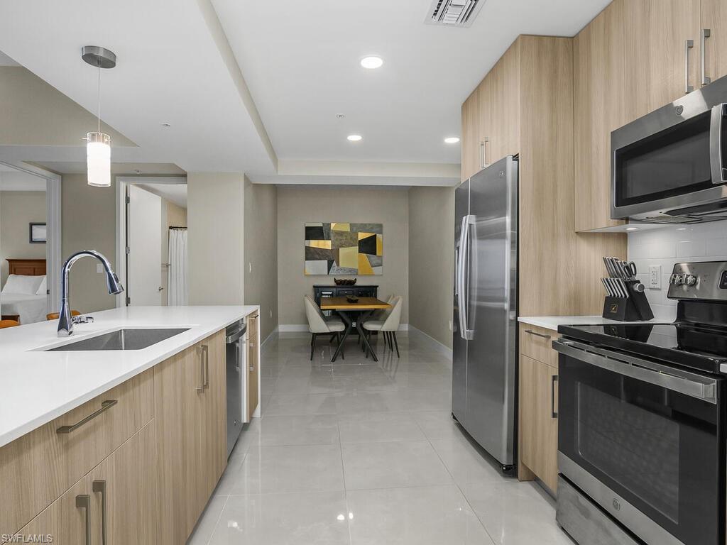 Views of the Den and Kitchen.  Den is currently being utilized as a dining room area