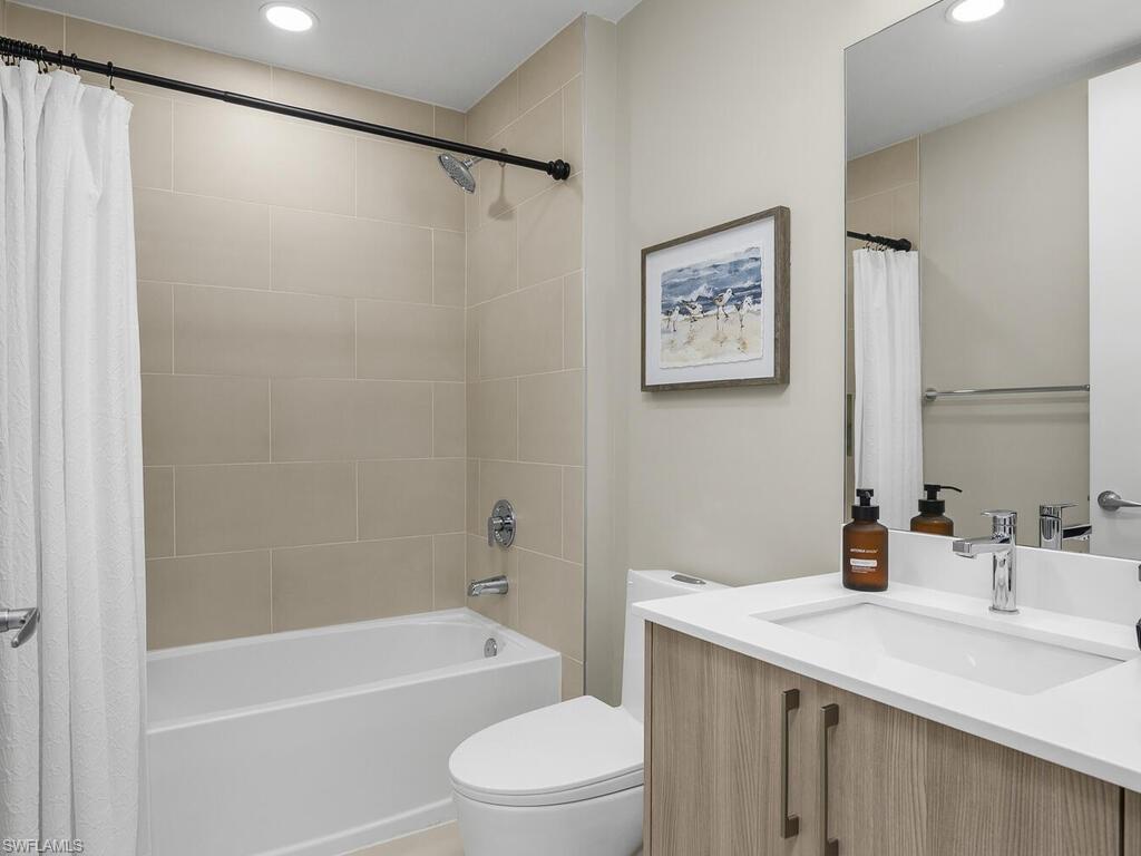 Guest bathroom offers a shower/tub combination