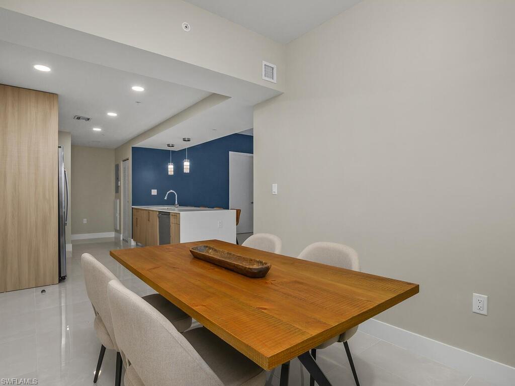 Considered a Den, this versatile room can be used for a dining room as shown, office or a den