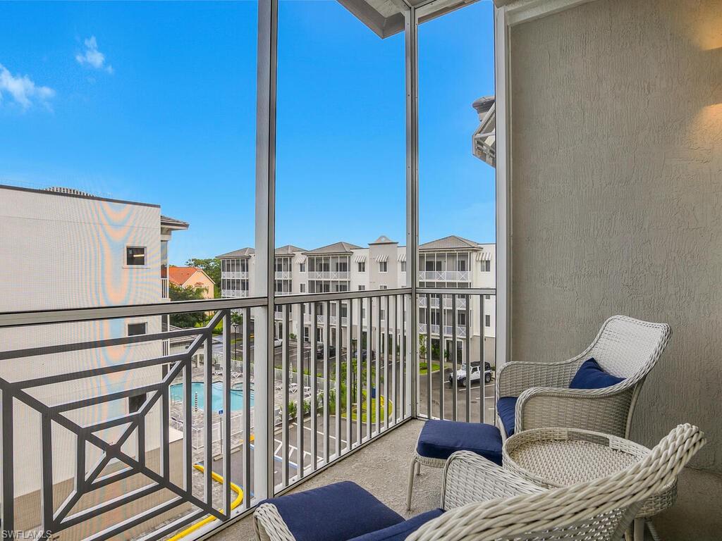 Key West style exterior design! Enjoy the partial pool view with the luxury of privacy - best of both worlds!