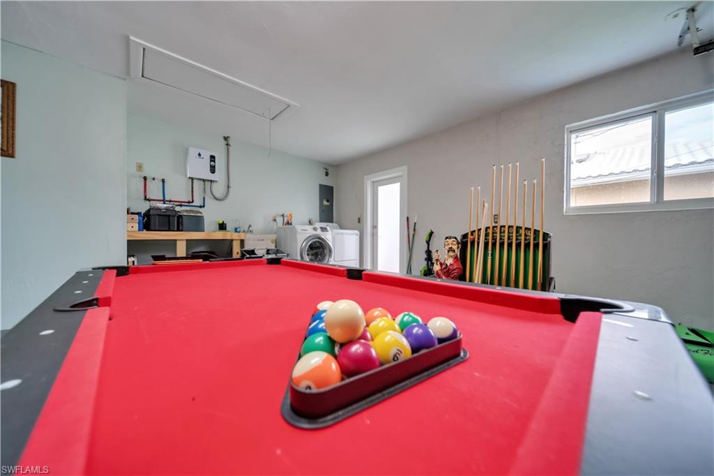 Recreation room with attic access, billiards, and electric panel