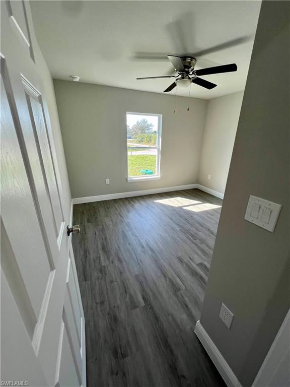 Kitchen featuring white cabinets, light wood-style flooring, light stone counters, and recessed lighting