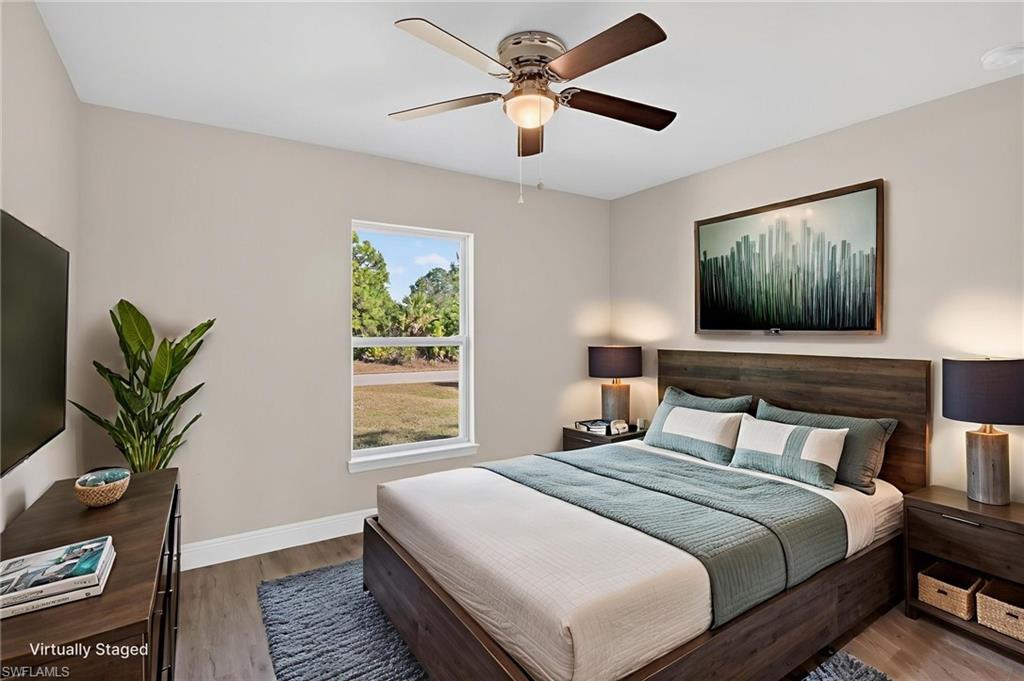 Bedroom featuring wood finished floors and ceiling fan