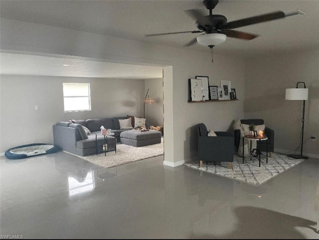 Living room featuring ceiling fan