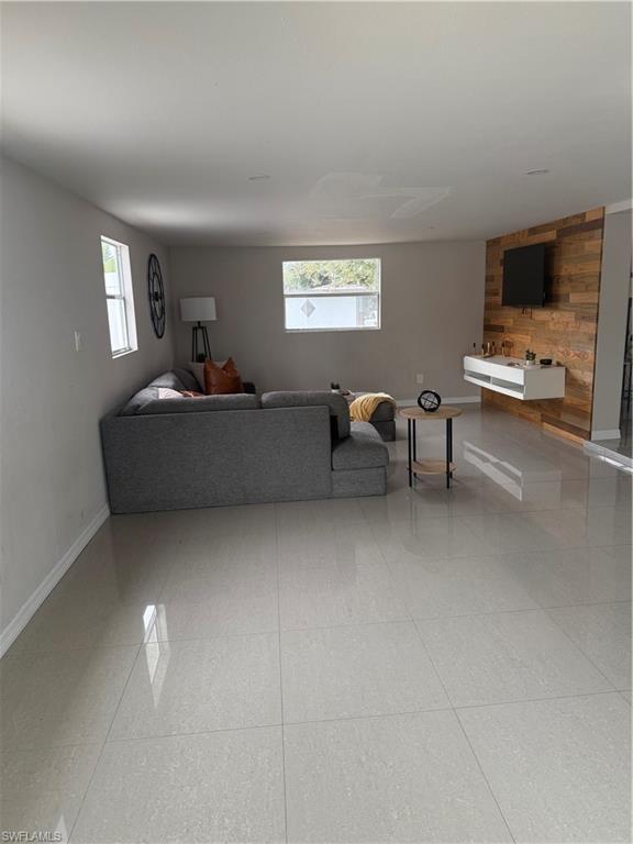 Living room with wood walls