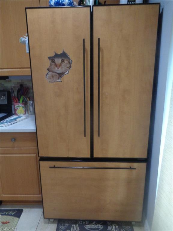 Detailed view of paneled built in fridge