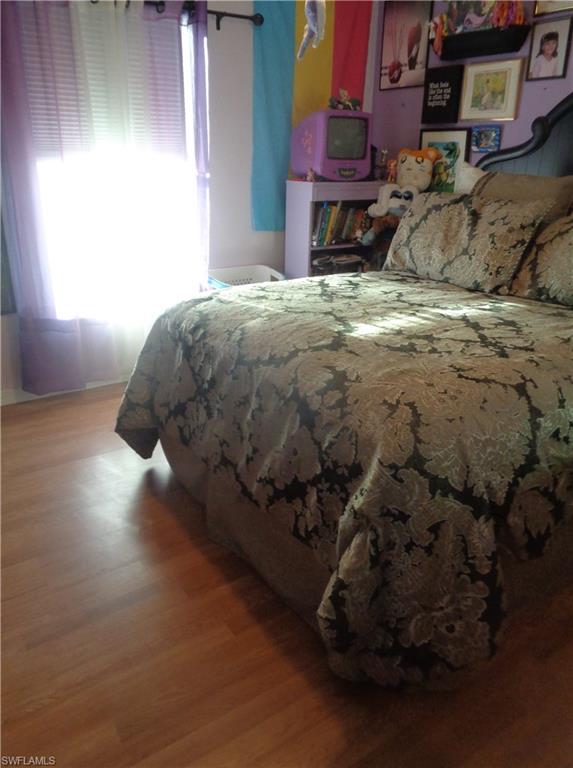 Bedroom featuring wood finished floors