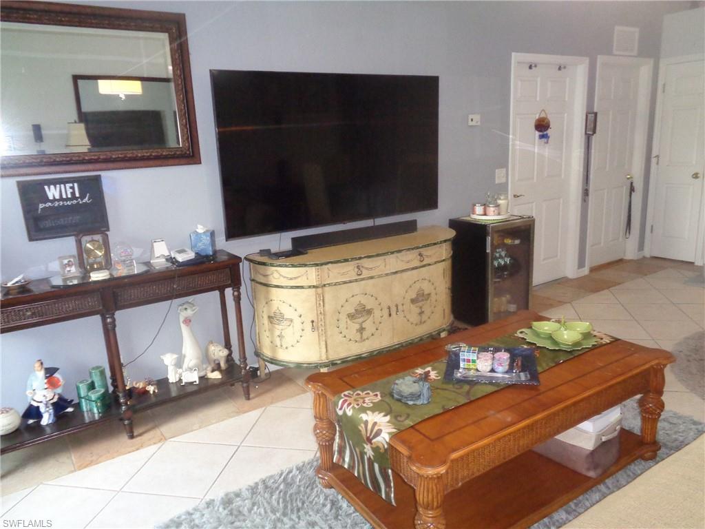 Living room featuring light tile patterned floors