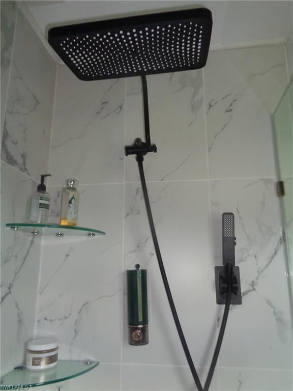Bathroom view of a marble finish shower