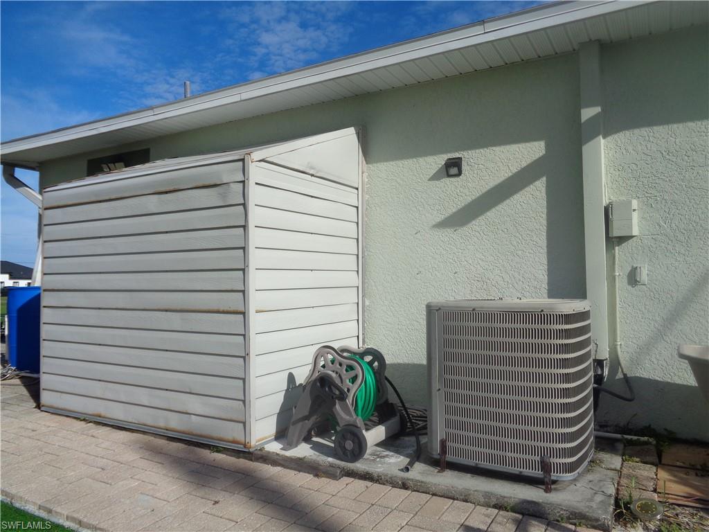 Exterior side of the house showing storage shed