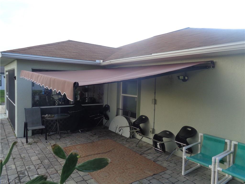 Extended awning on back patio next to screened lanai