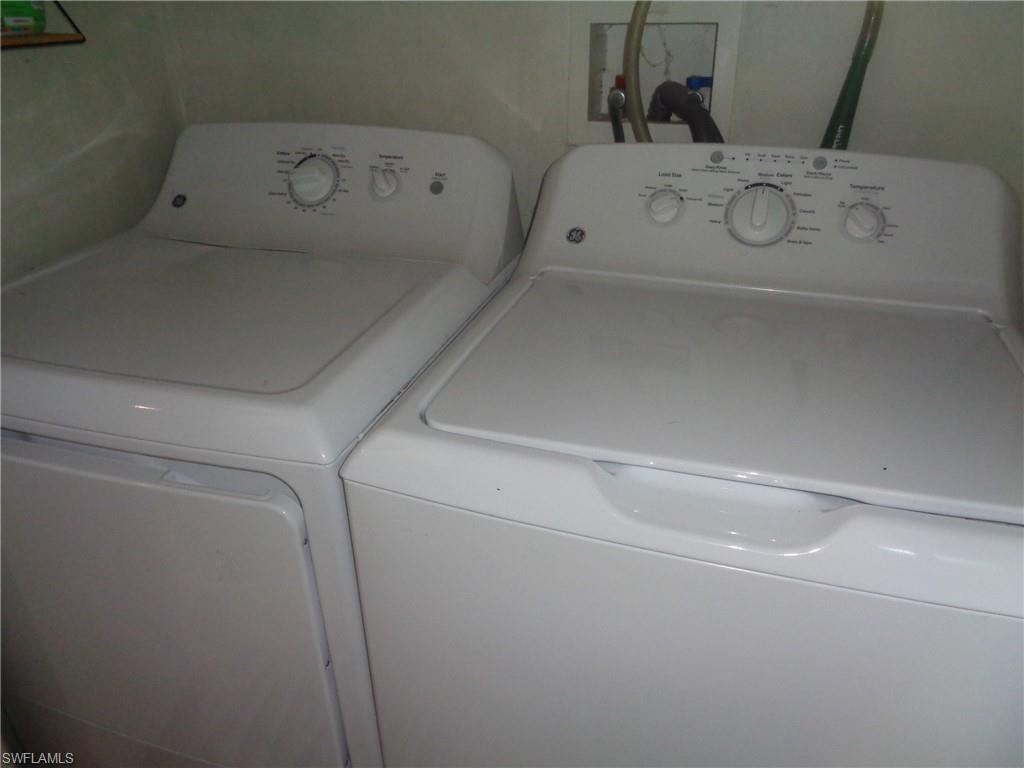 Laundry room featuring independent washer and dryer