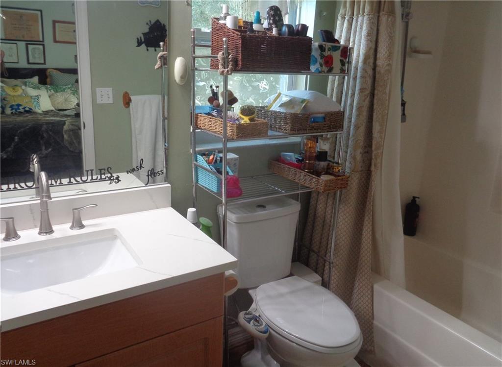 Full bathroom featuring vanity and shower / tub combo