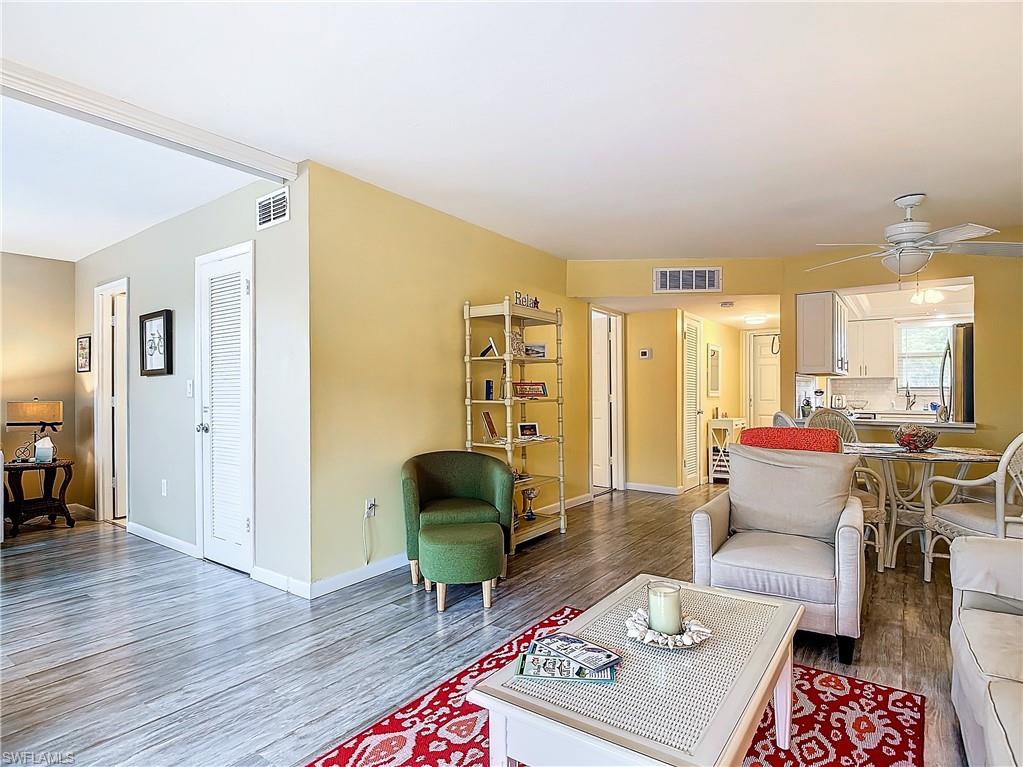 Living room featuring hardwood / wood-style floors and ceiling fan