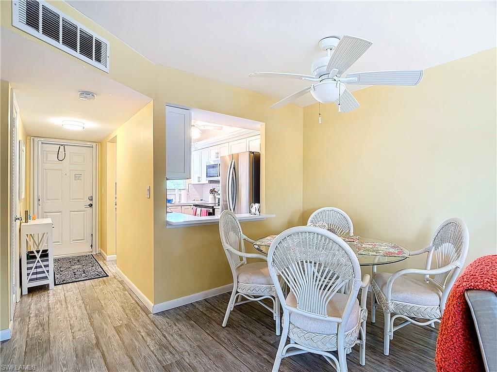 Dining area featuring ceiling fan and hardwood / wood-style flooring
