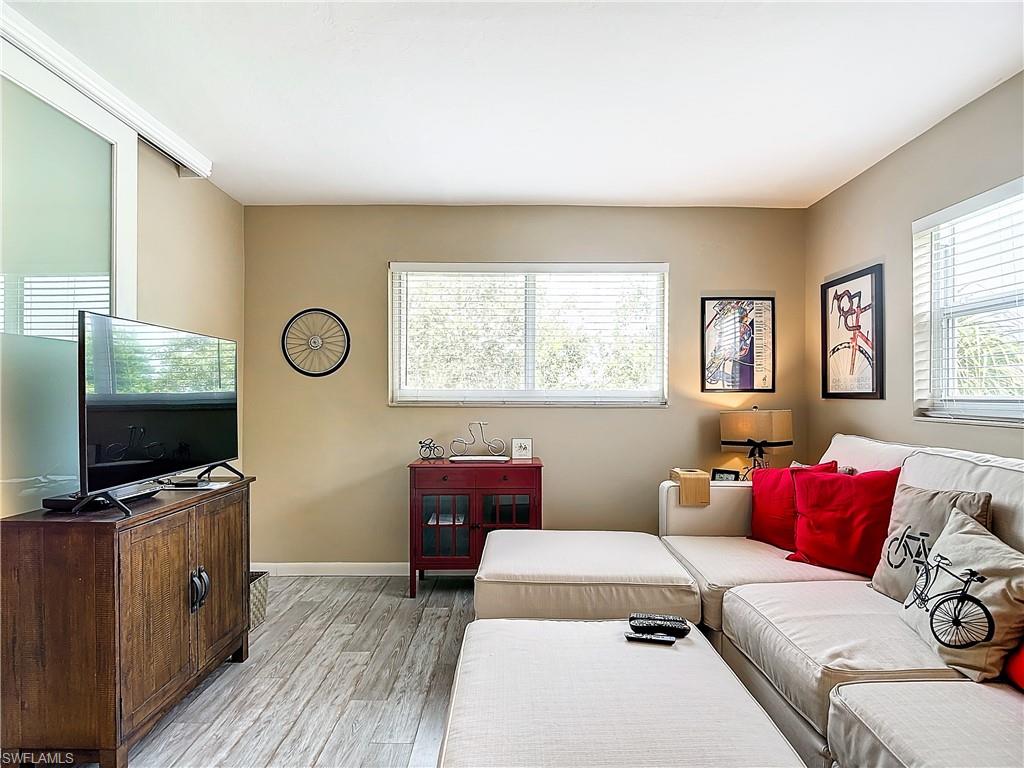 Living room with light hardwood / wood-style flooring