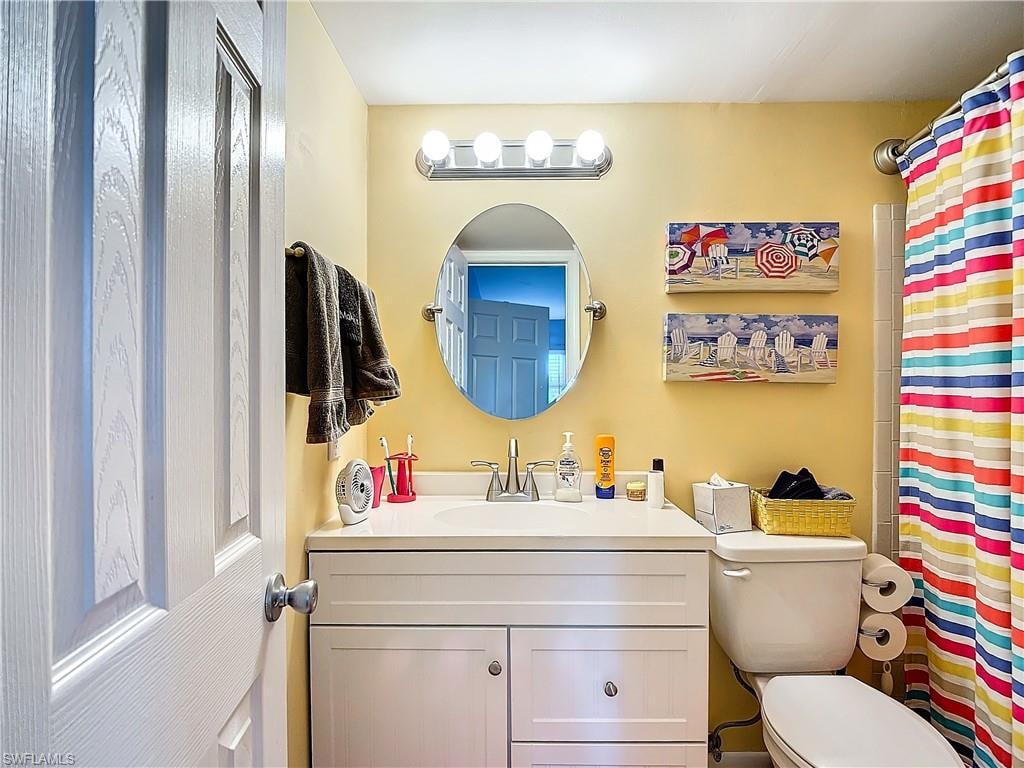 Bathroom with toilet and vanity