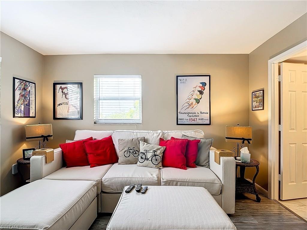 Living room with hardwood / wood-style flooring