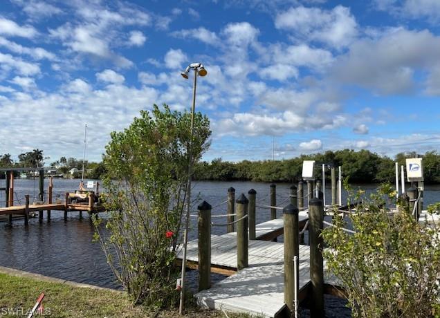 Dock featuring a water view and boat lift