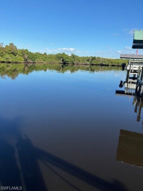 Dock area featuring a water view