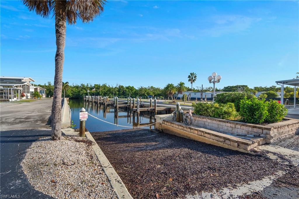 Dock with a boat ramp and a water view