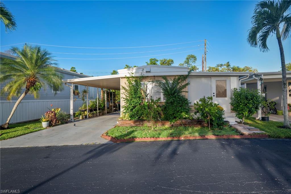 Front of home featuring Carport