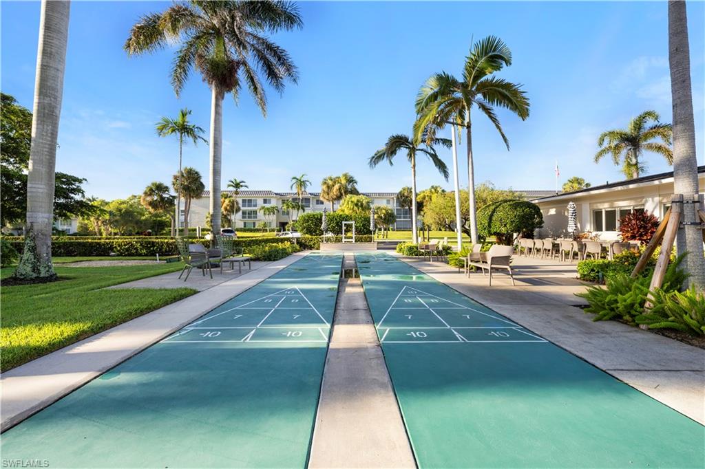 View of home's community featuring shuffleboard