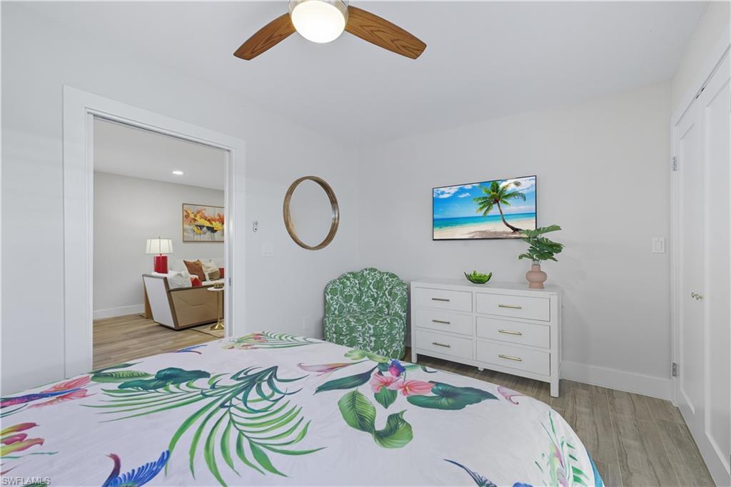 Bedroom with light wood-style flooring and ceiling fan