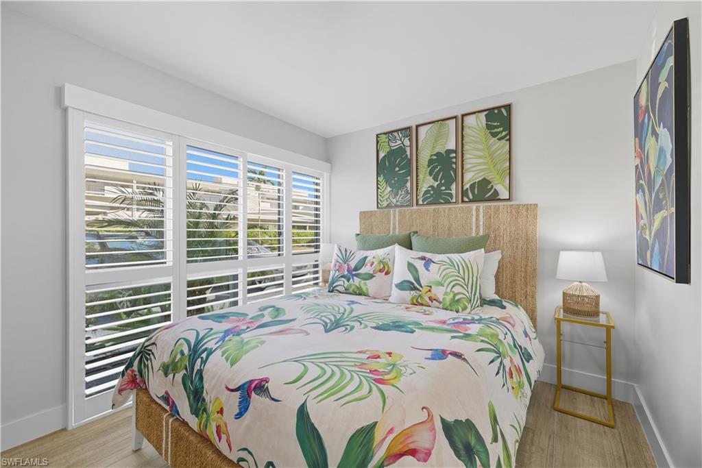 Bedroom featuring baseboards and light wood-style flooring
