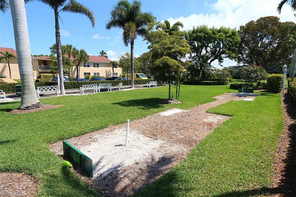 View of home's community with a lawn