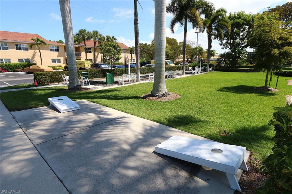 View of property's community with a yard