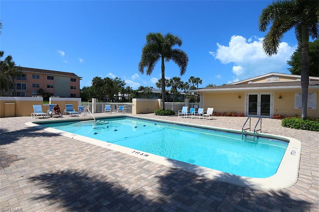 Community pool with a patio