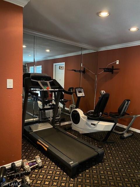 Workout area featuring crown molding