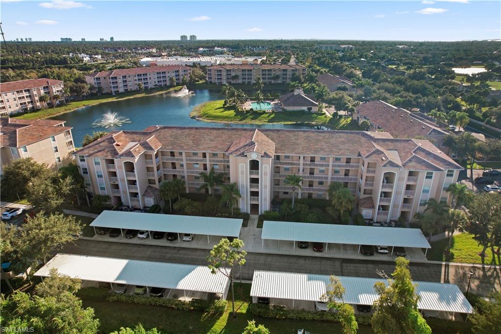 Aerial view of apartment complex and a large body of water